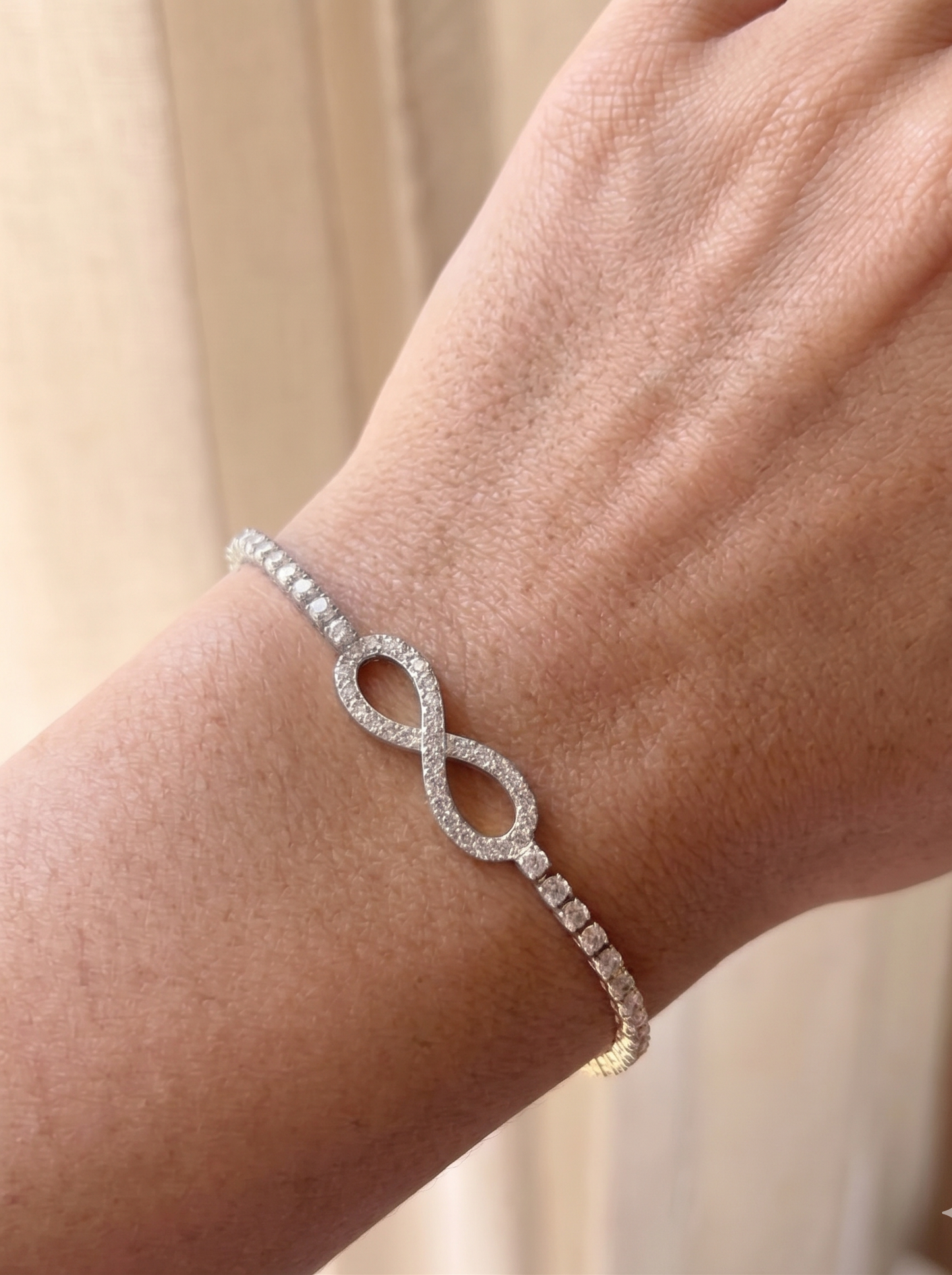 Silver Plated Tennis Bracelet with Infinity Emblem